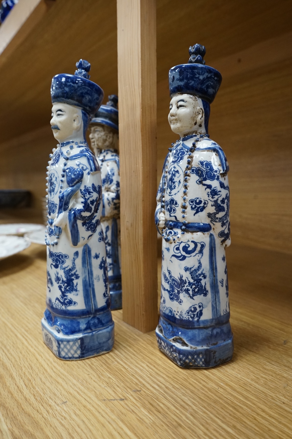 Three Chinese blue and white porcelain figures H 29cm x 9cm., and a Delft tobacco jar H 26cm W 18cm